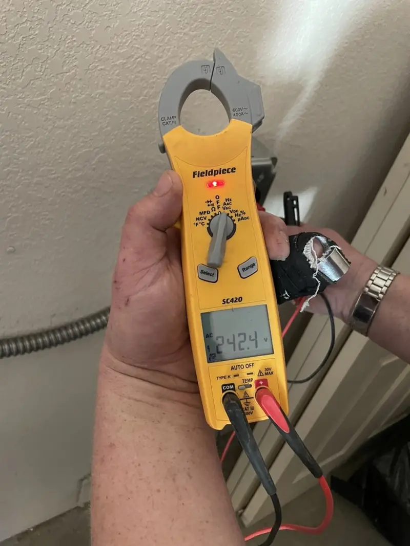 Voltage testing with clamp meter during Ceiling Fan Installation in Glendale